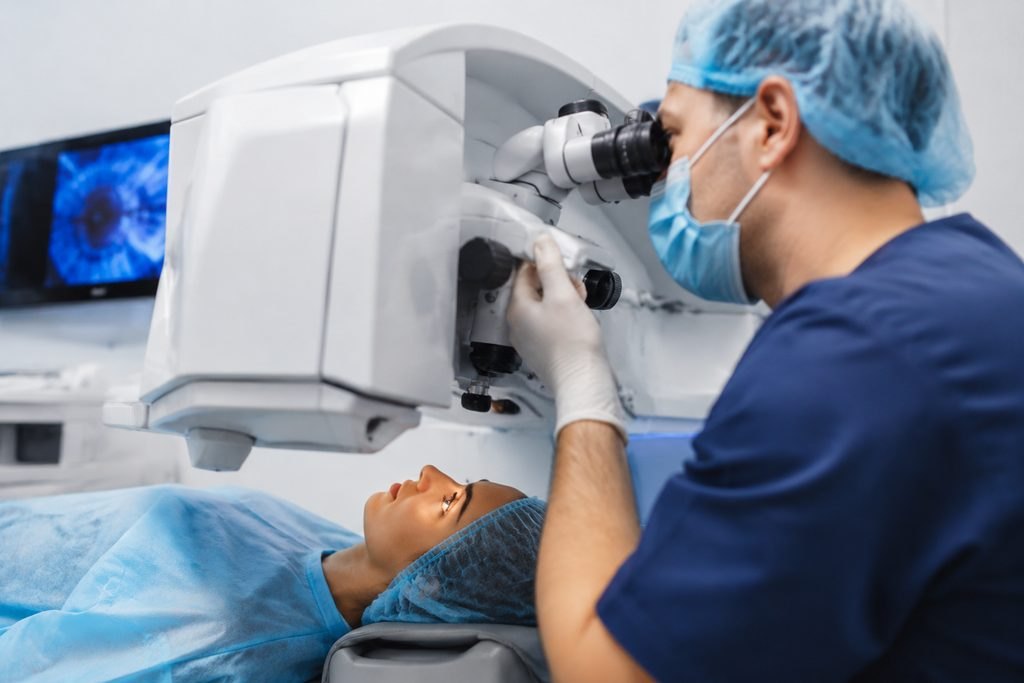 Illustrative image: A medical professional examines a patient using an ophthalmic microscope in a clinical setting.